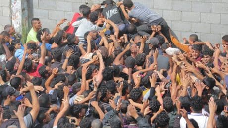 Battle over trickle of aid into Gaza as armed gangs intercept trucks carrying supplies