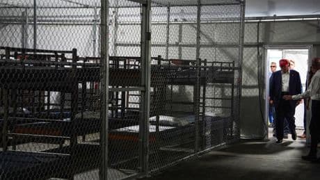 Photos of Trump touring an immigration detention center dubbed 'Alligator Alcatraz'