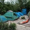 Gunfire at French migrant camp kills one and wounds five including a child as adult and 17-year-old arrested