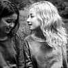 Can YOU spot the face? This photo of two girls has a third person hidden in it - so, can you see them?