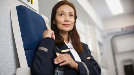 Real reason cabin crew sit on their hands when landing and taking off