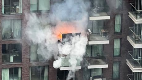 Huge fire erupts at London tower block with two flats engulfed in flames as 100 firefighters scrambled