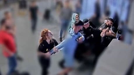 Moment 'brothers throw flurry of punches' at armed Manchester Airport cops