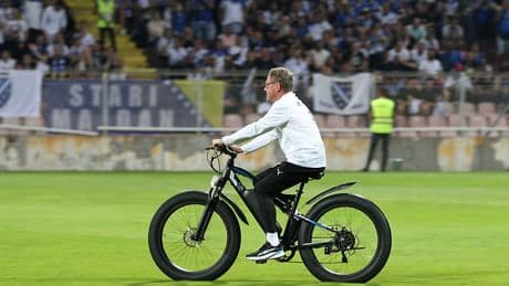 Bizarre moment ex-Man United manager Ralf Rangnick rides a BIKE on the pitch