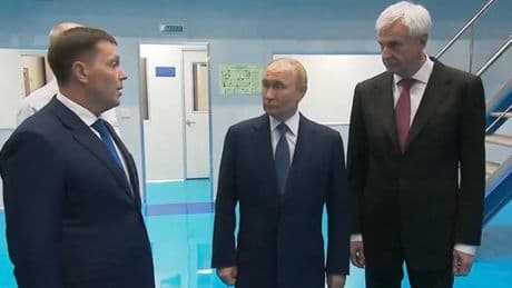 Putin stops off at fish factory on way to Alaska for crunch Trump meeting