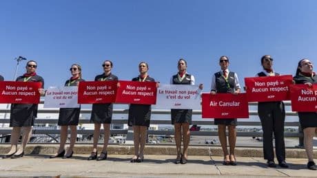 Air Canada flight attendants issue strike notice, as company plans lockout