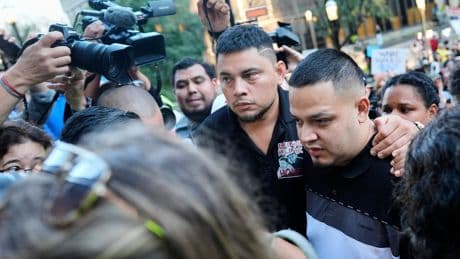 Photos of Abrego Garcia turning himself in at ICE office surrounded by family and supporters