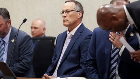 Judge throws out murder charge against Michigan officer who struck a fleeing man