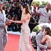 Emily Blunt steals the show in a dazzling strapless gown as she puts on a playful display with The Rock at The Smashing Machine premiere during The Venice Film Festival