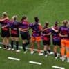 England players and subs stand in support of Carter