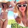 Millie Mackintosh shows off her toned figure in a skimpy cream bikini after admitting she wishes she got bigger breast implants