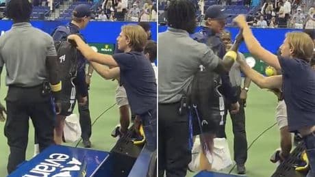Shocking moment brazen US Open fan tries to STEAL from Jannik Sinner's bag while it's on his back