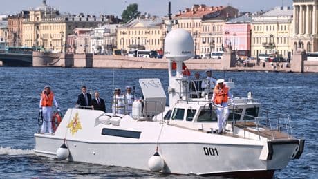 Russia scales down celebrations honoring its navy as Ukraine launches more drone attacks