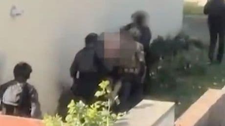Moment armed cops storm home as UK terror swoops see eight men arrested