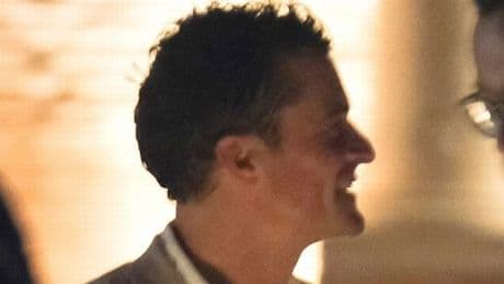 Orlando Bloom cosies up to mystery woman at Jeff Bezos' wedding party after Katy Perry split