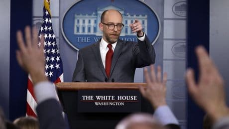 The White House rejects a watchdog finding that it's breaking the law over halted funds
