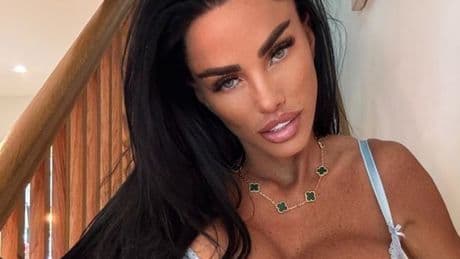 Katie Price poses with plaster on her bum as she shows off the results of latest surgery