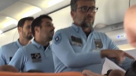 Shocking moment police storm easyJet plane after Brit stag do's alleged antics