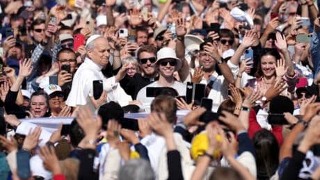Pope Leo XIV greets tens of thousands from popemobile ahead of historic Vatican inauguration