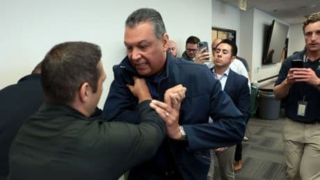 Handcuffed Democrats become symbol of Trump's crackdown on dissent