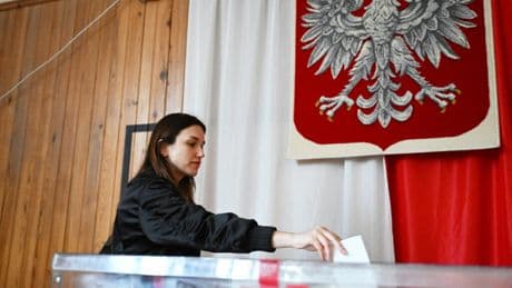 Poles begin voting for new president in pivotal runoff election