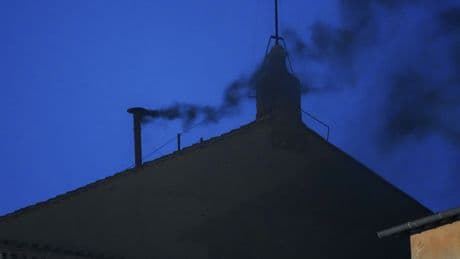Black smoke rises from the Sistine Chapel as cardinals cast an unsuccessful first vote