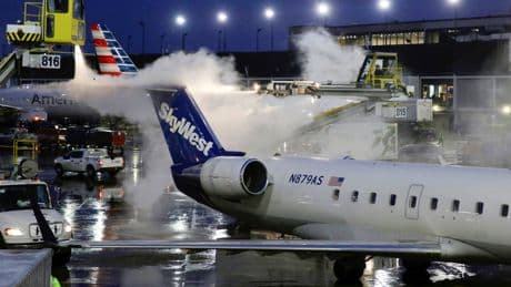 SkyWest flight forced into emergency landing after unruly passenger fights crew and attempts to open door, police say