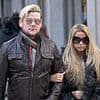 Katie Price's pal Phil Turner looks unrecognisable as he shares passions for DIY with husband Gary Cockerill - after reality star nearly 'ruined' their wedding