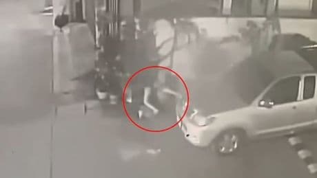 Horror moment woman gives birth behind a car during street festival before leaving newborn to die as she parties on