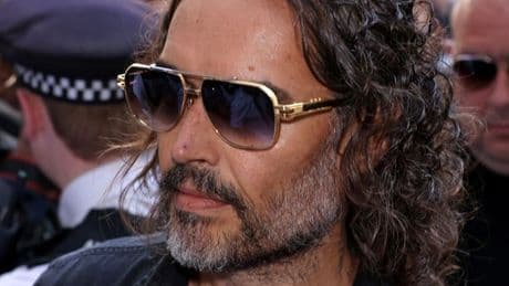 Russell Brand arrives at court as he's set to face rape and sexual assault charges