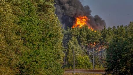 Explosions heard in Lithuania's capital after railcars loaded with liquefied gas catch fire