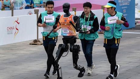 Watch humans face robot competitors for first time in half marathon