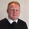 Funeral director appears in court accused of fraud and 30 counts of preventing a lawful burial after human remains were discovered at parlour