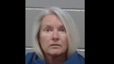 Woman claimed her ex-husband was fishing with his new girlfriend. Cops say she killed him and hid him under rugs in their carport