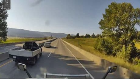 Caught on camera: House falls on Highway 97 during transport