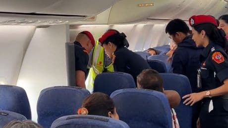 Moment passenger dragged off plane after demanding specific seat due to size