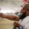 Symbolism and smiles during the stoning of the devil ritual at the Hajj