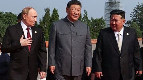 Chinese leader XI Jinping cozies up to Vladimir Putin at military parade