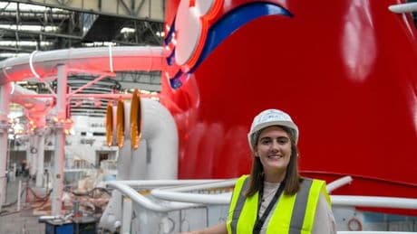Inside huge shipyard building Disney cruise ships with cranes lifting 800-ton blocks