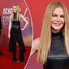 It's all about me! Nicole Kidman steals the spotlight at the Country Music Awards as husband Keith Urban stands in the background - despite being up for the Triple Crown Award