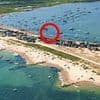 Drunken sailors will destroy our seaside idyll: Owners of Britain's most expensive beach huts fears 'rabble of partygoers' using new floating restaurant will ruin their peace and quiet
