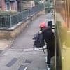 Sickening moment brazen thief smashes his way into ambulance to steal paramedics' rucksacks while they are busy treating a patient