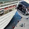 Cruise passengers look devastated as ship sets off without them after they turned up 30 minutes late - as partying holidaymakers wave goodbye