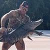 Shocking moment barefoot Florida man battles 10-foot alligator on side of highway