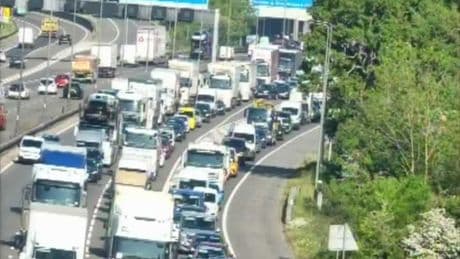 Two arrested after lorry overturns and spills waste in M25 crash