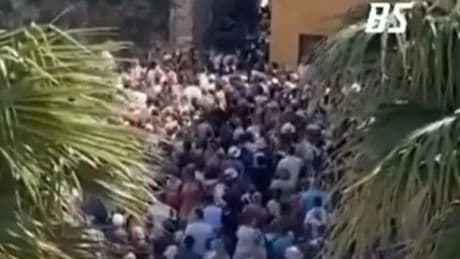 Horror vid shows tiny Italian town SWAMPED by 75,000 tourists in one weekend as visitors left crushed in narrow streets