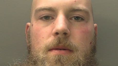 Armoured thug stabbed officer and knocked another unconscious in police station attack