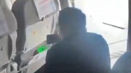 Moment chaos breaks out on flight as passenger opens emergency exit 'to get some air'
