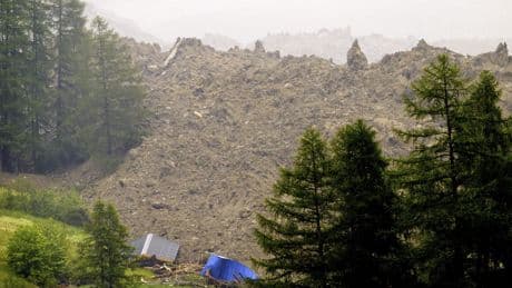 Rock slide hits Swiss Alpine village that authorities had ordered evacuated