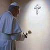 Pope Leo XIV lays a white rose on the tomb of the late Pope Francis as he pays touching tribute to his predecessor